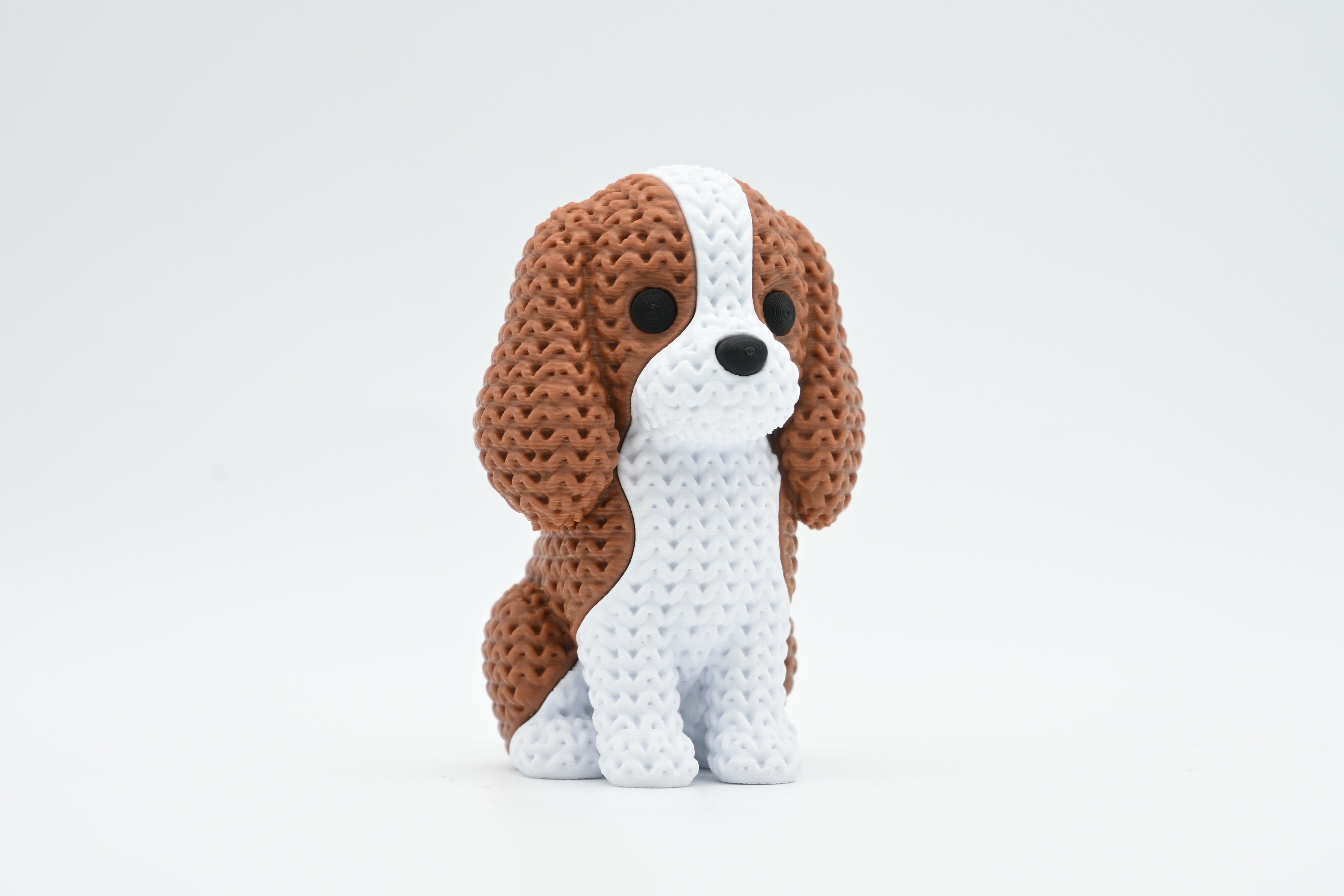 Cavalier King Charles Spaniel Figure: Knitted Texture Design.